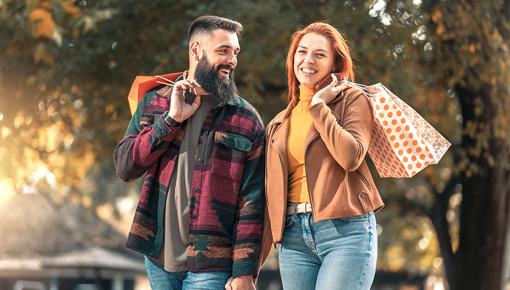 Couple with Shopping Bags in the Autumn