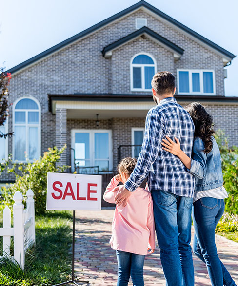 Photo of Couple outside a House