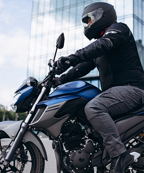 Photo of Man on Motorcycle