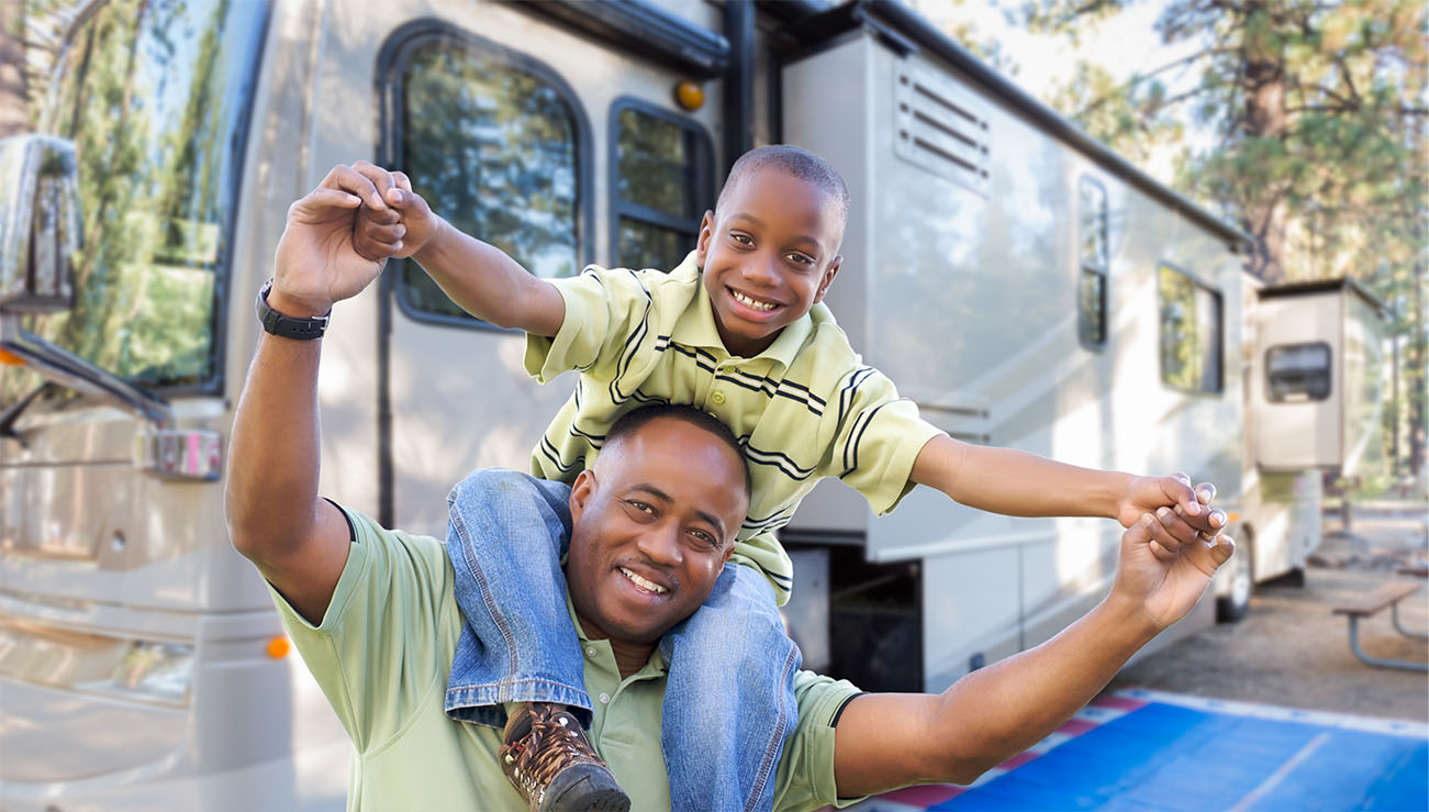 Father and Son in front of an RV