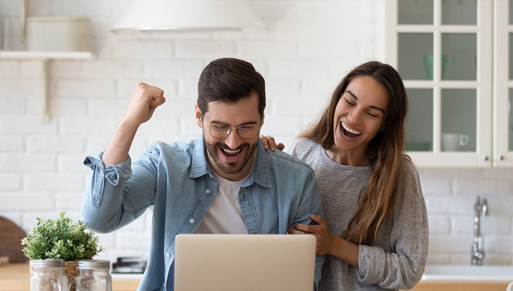 Excited Couple at Computer